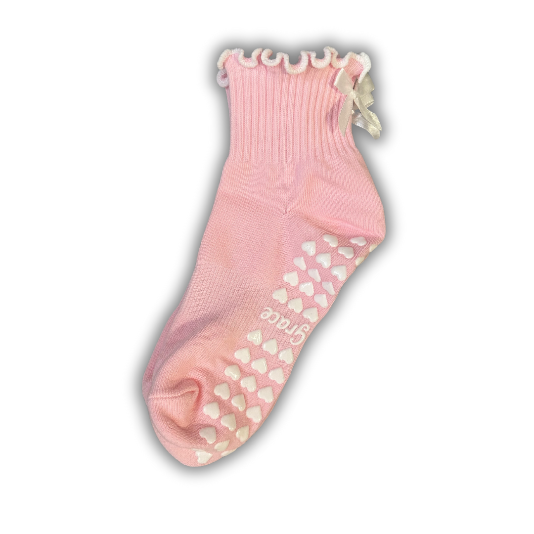 Light pink ruffle grip socks with white bow