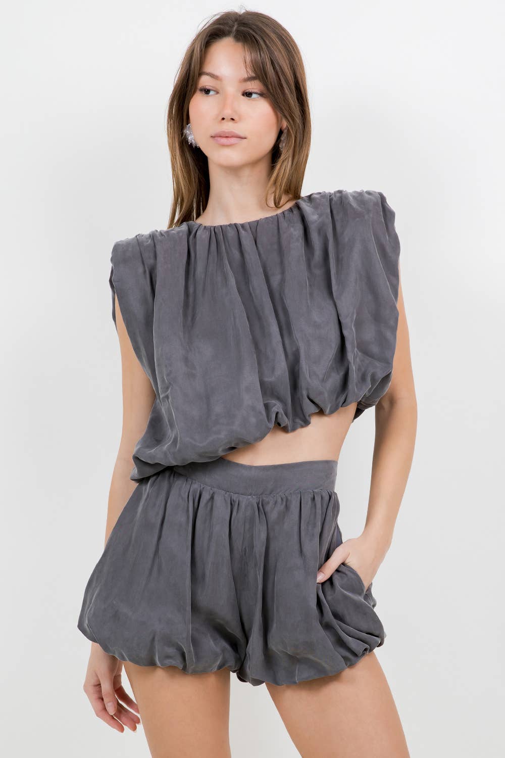 ASYMMETRICAL HEMMED WITH SHOULDER PAD WOVEN TOP - CHARCOAL