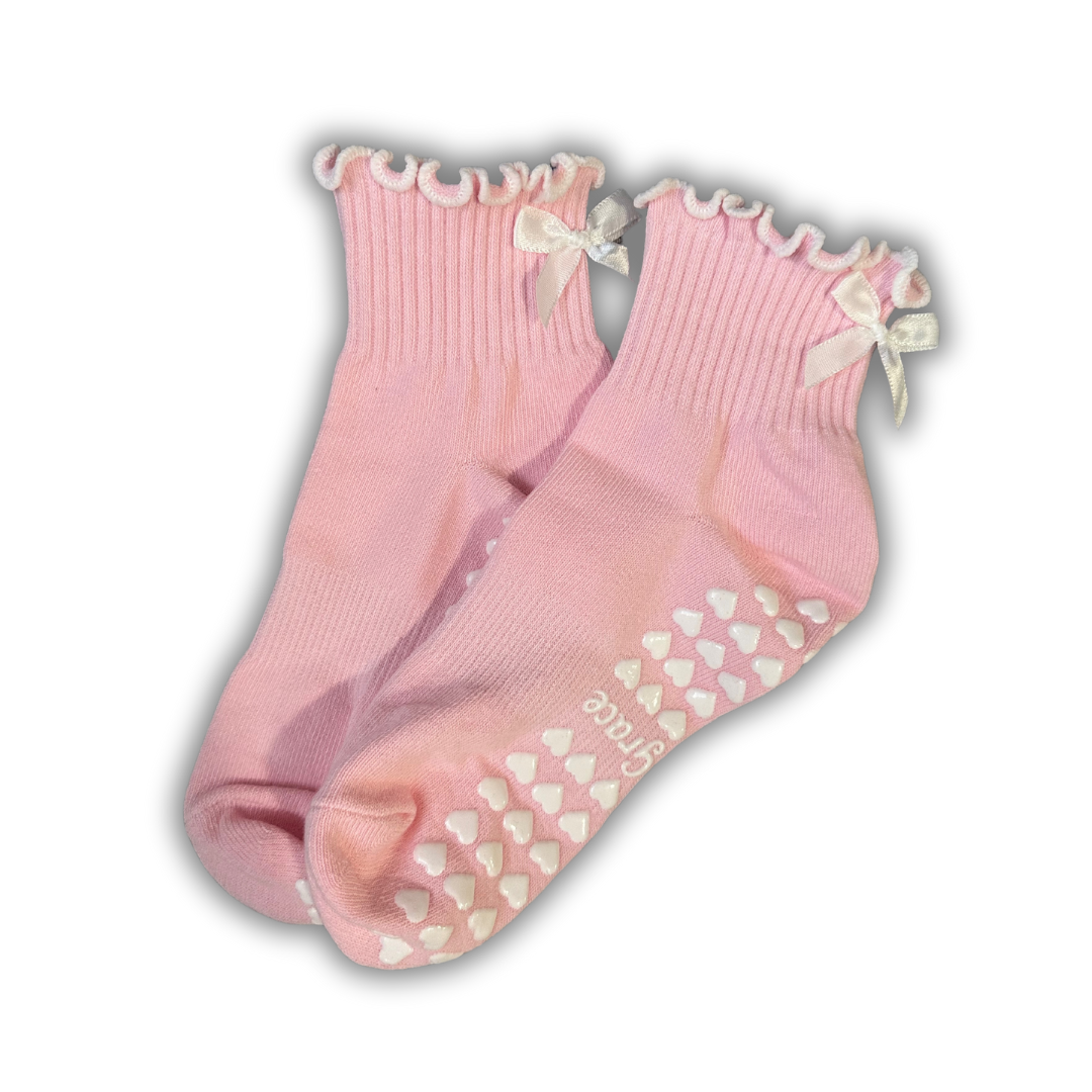 Light pink ruffle grip socks with white bow